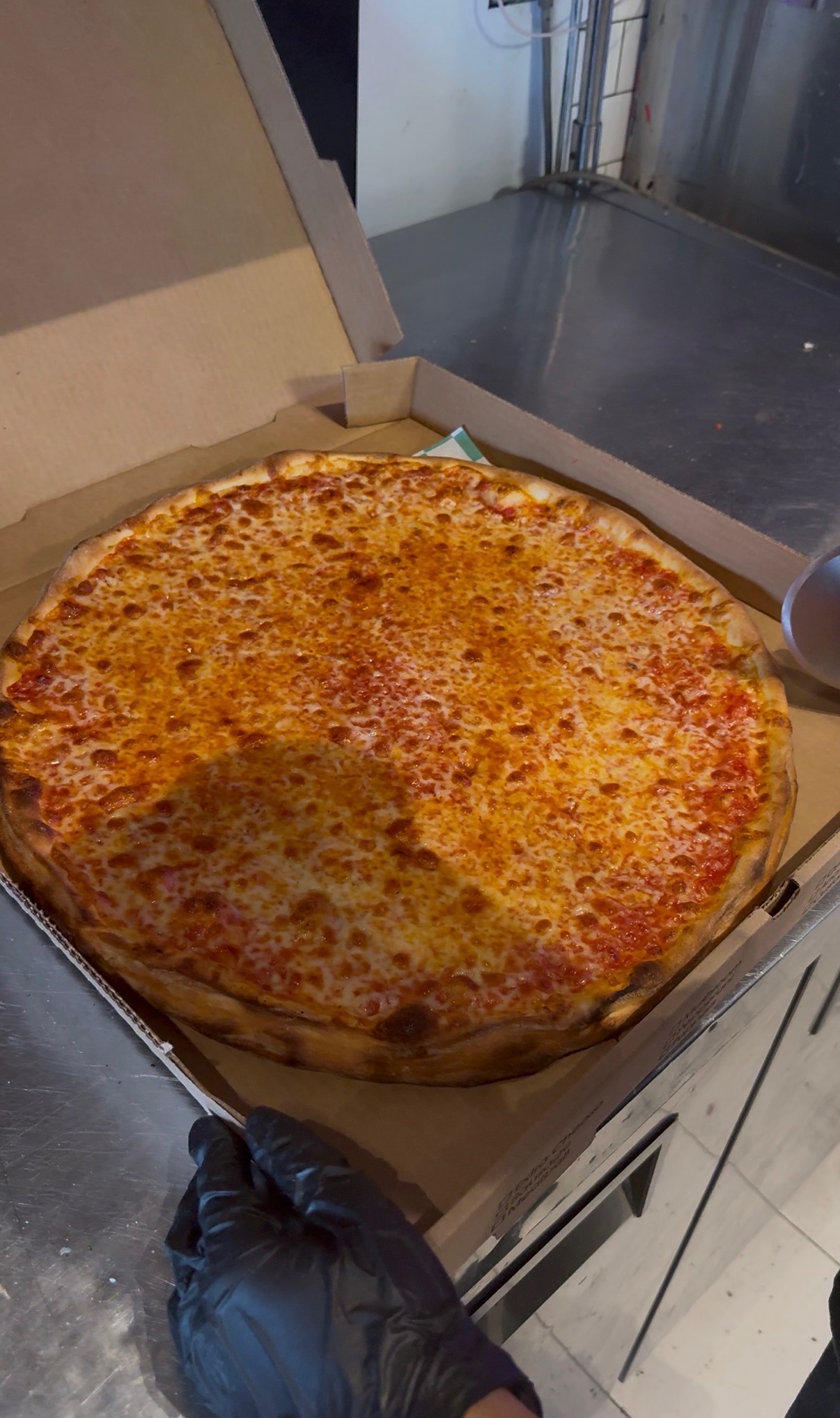 Classic cheese pizza at Angela's Pizza